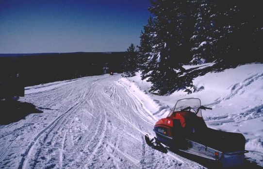 snowmobile on the side of trail